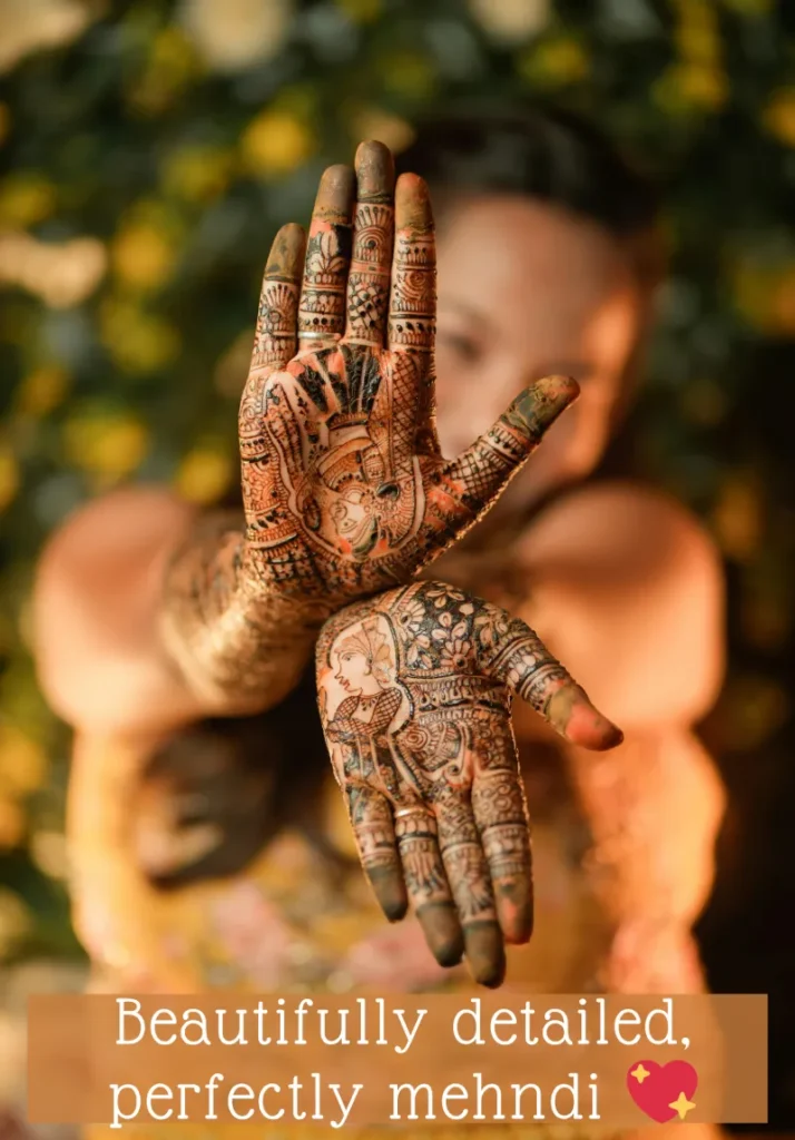 350+ Perfect Mehndi Captions for Instagram with Emojis 8 Close-up of a young girl's hands showcasing intricate and artistic traditional Indian mehndi (henna) designs, highlighting their beauty and detail, with the caption 'Beautifully detailed, perfectly mehndi β€οΈ'.