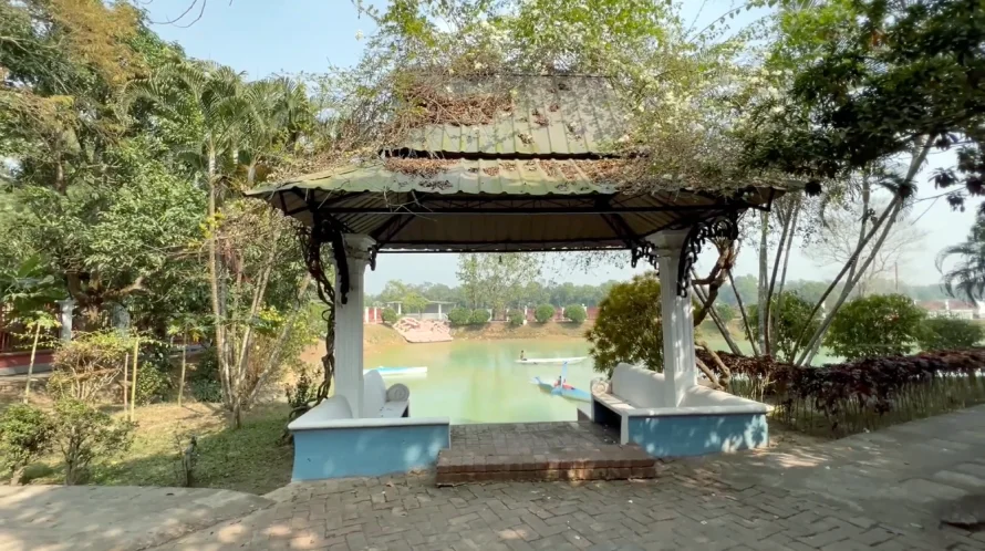 Best Resorts for Couples in Gazipur, Dhaka 21 Gazebo Covered With Vines Overlooking A Tranquil Lake At Angana Resort In Gazipur, Bangladesh, With Paddle Boats On The Water And Lush Greenery All Around.