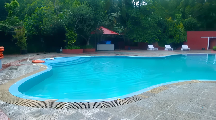 Best Resorts for Couples in Gazipur, Dhaka 5 Outdoor Swimming Pool Surrounded By Greenery At Chhuti Resort, Gazipur.