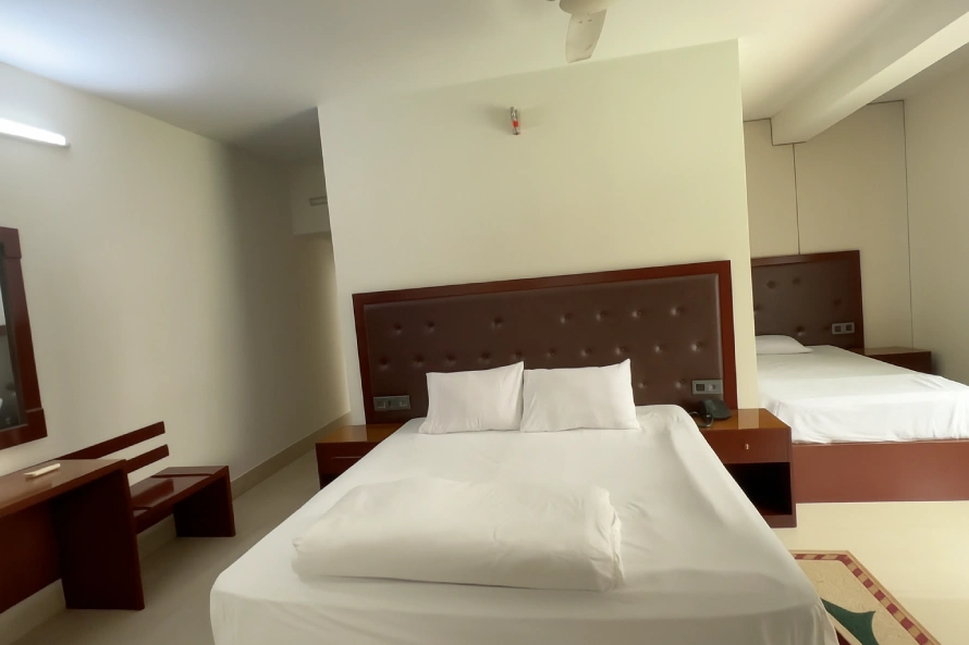 Best Resorts for Couples in Gazipur, Dhaka 3 Interior Of A Deluxe Room At Meghbari Resort In Gazipur Featuring A Queen Bed, Modern Furniture, And Natural Lighting.
