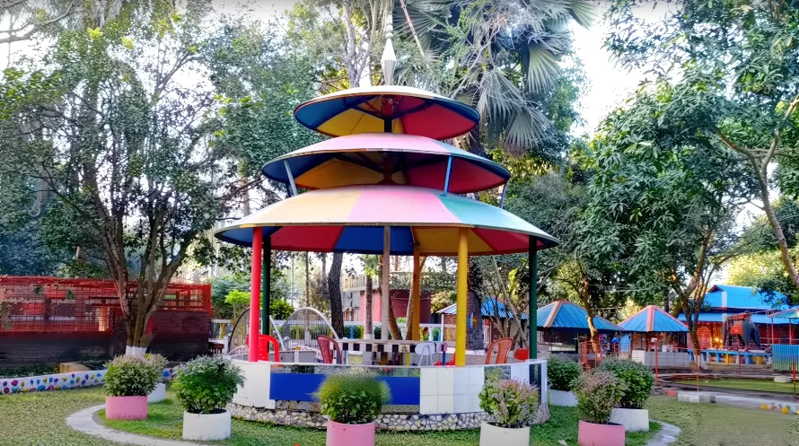 Best Resorts for Couples in Gazipur, Dhaka 17 Colorful Multi-Tiered Gazebo Surrounded By Greenery At Sabah Garden Resort In Gazipur, Bangladesh – A Family-Friendly Nature Destination With Outdoor Seating.