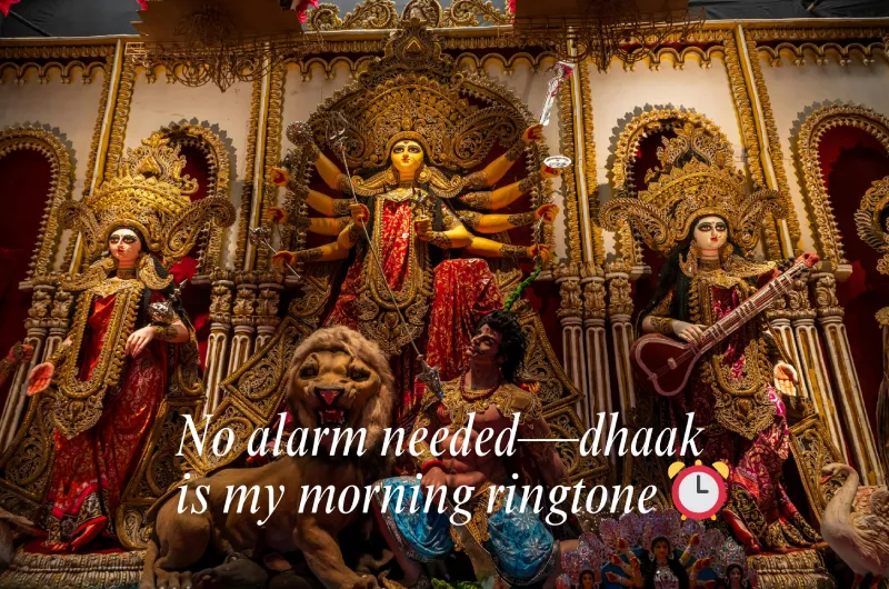 Best Durga Puja Captions, Wishes and Quotes for Social Media 2 A Beautifully Decorated Durga Idol With Her Lion, Set Against An Ornate Backdrop, With The Text &Quot;No Alarm Needed—Dhaak Is My Morning Ringtone ⏰&Quot;.